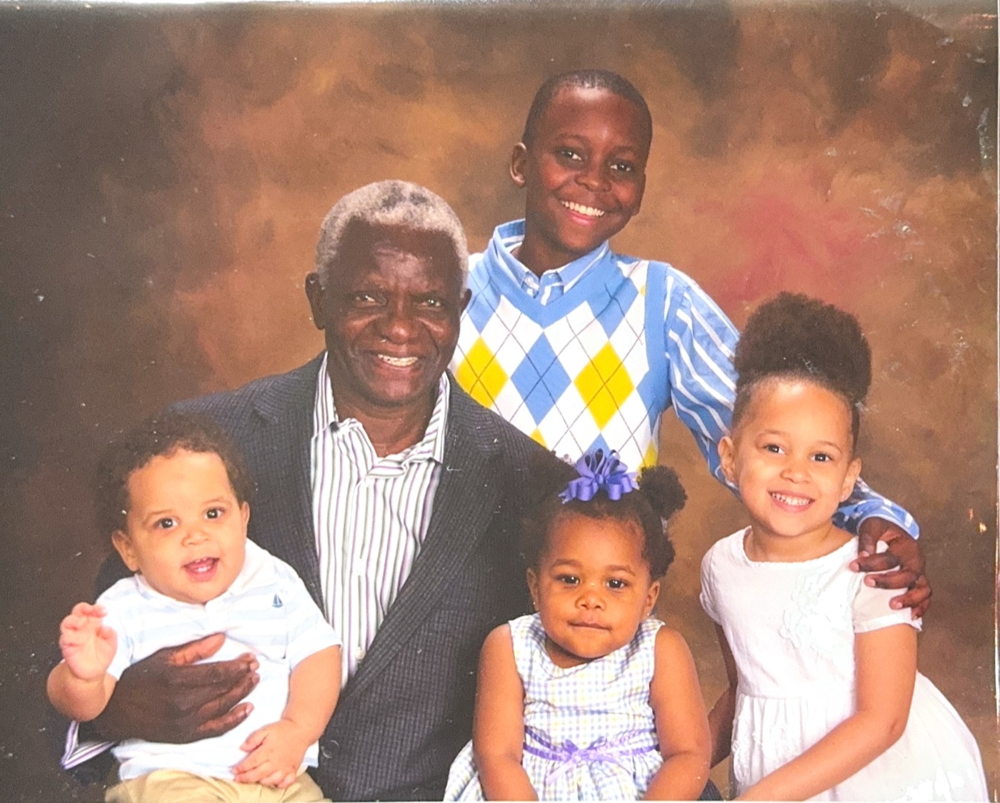 Henry Kanyanta Musoma with his grandchildren
